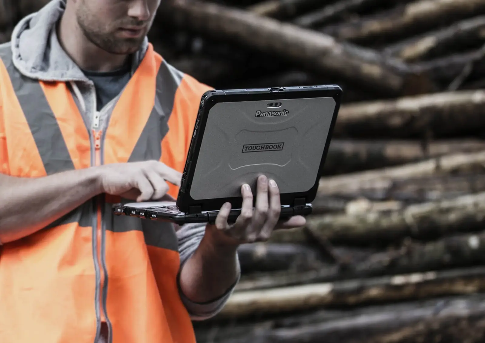 Forestry worker using a Panasonic Toughbook outdoors
